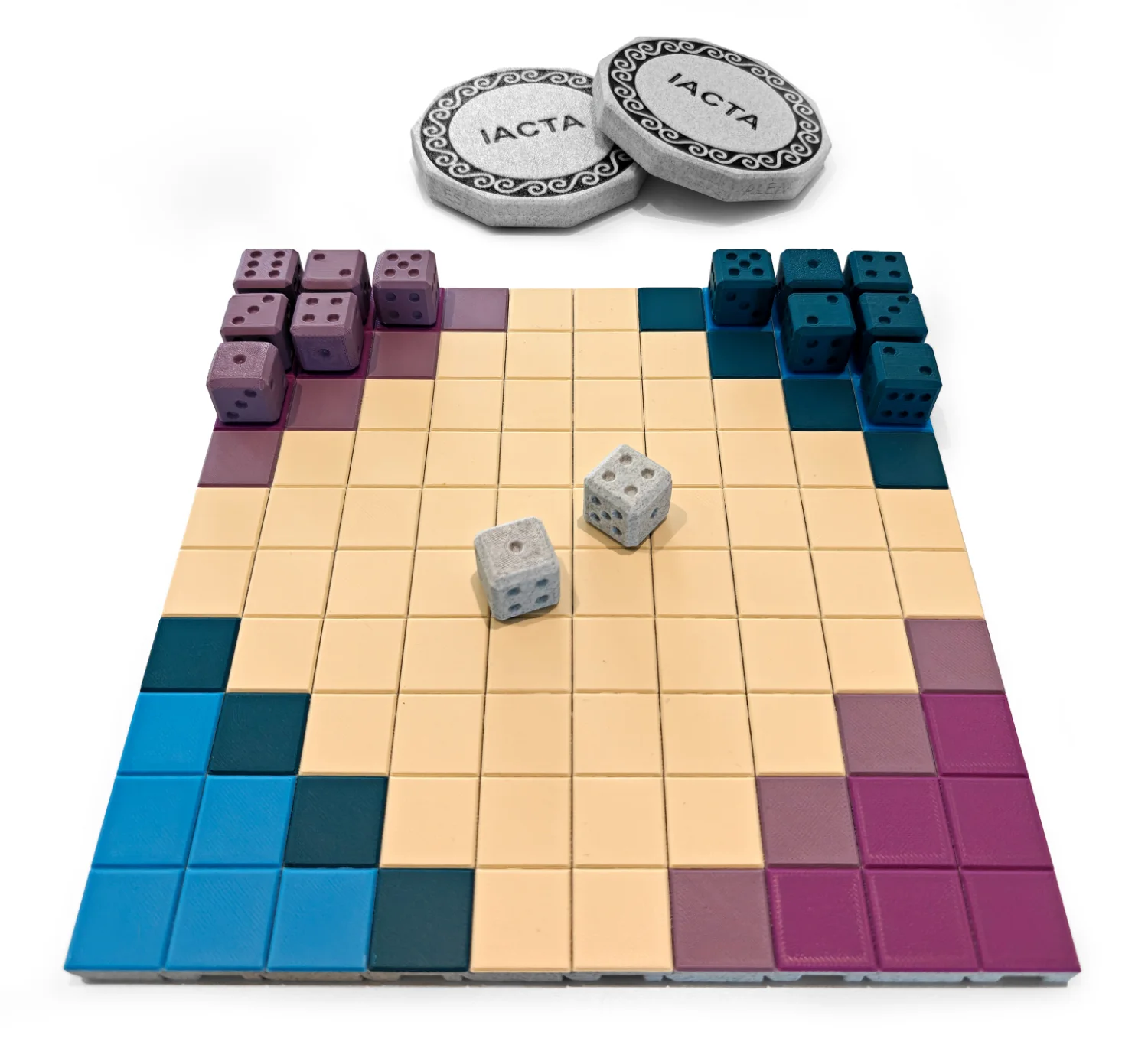 The 3D-printed Iacta board set up to play, with dice and IACTA throwing stones
